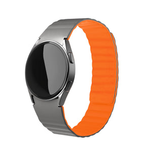 Magnetic Silicone Strap, grey/orange, on a watch, 3/4 front view