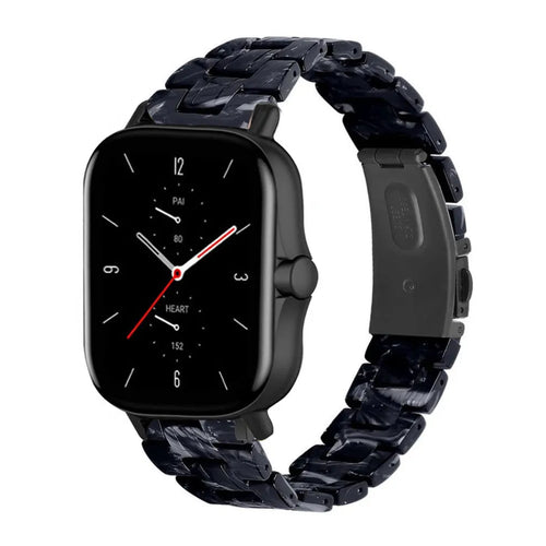 Metal Resin Strap, black/white, on a watch, 3/4 front view