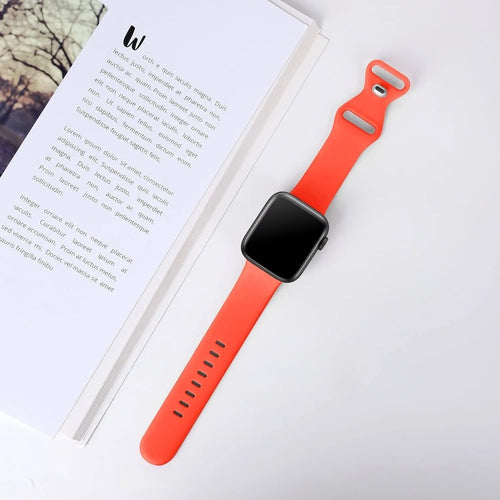 Silicone Strap 'Classic', coral, on a watch, 3/4 front view