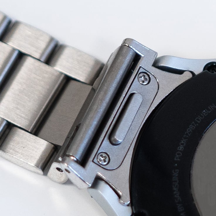 Steel Strap 'One Push', silver, on a watch, 3/4 rear view