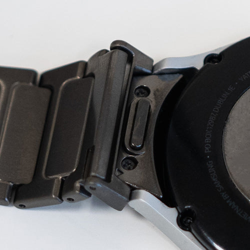 Titanium Strap 'One Push', graphite, on a watch, 3/4 rear view